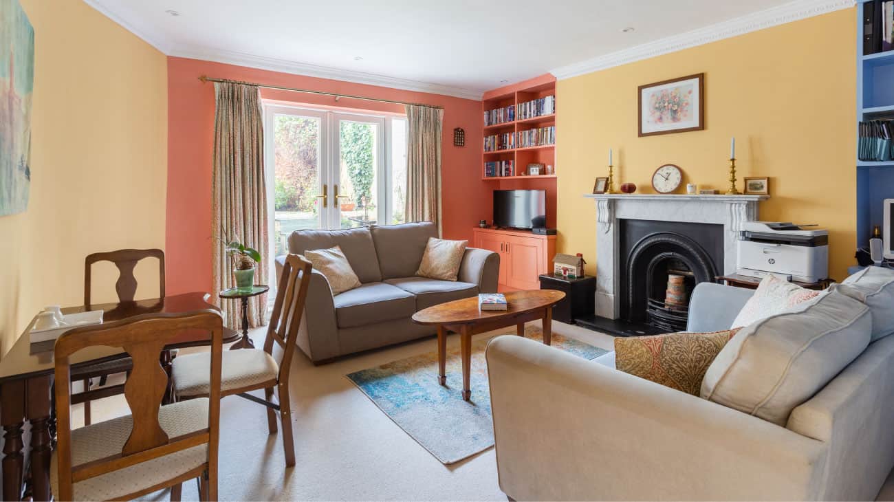 living room design with feature fireplace in colourful flat Gloucestershire feel right at home seasonal soul home
