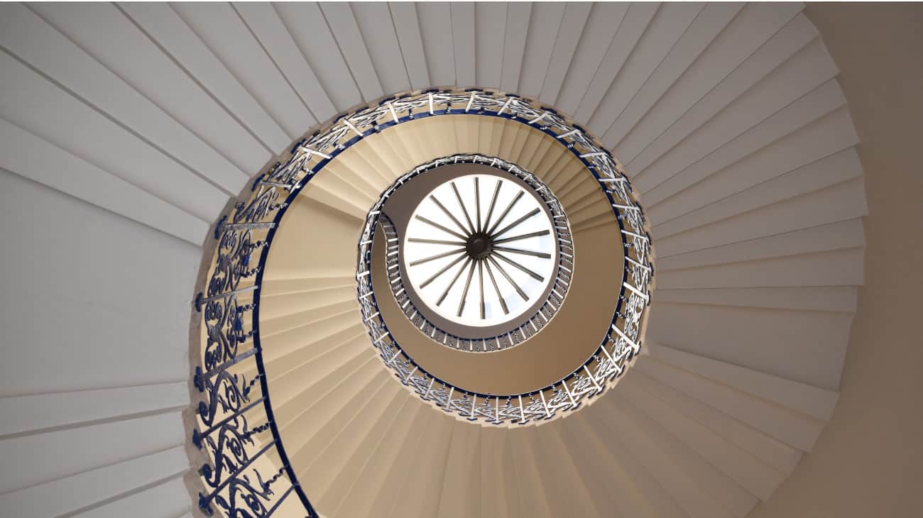 minimalist feature spiral staircase with ironwork ballustrade and spindles